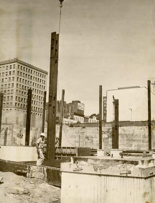 JOURNAL STAR FILE PHOTO
The first steel beem was raised from the footings for the new Caterpillar office building in downtown Peoria in this July 26, 1965 photo. The $7 million, 134-foot-tall building was completed in 1967.