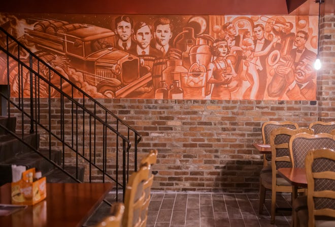 A new mural by local artist Devon McGlone harkens back to the Prohibition-era of Peoria's history at the new Richard's Under Main in downtown Peoria.