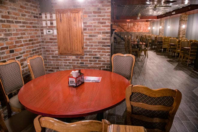 A round table next to the fireplace has been refinished and is ready for customers at the new Richard's Under Main in downtown Peoria.