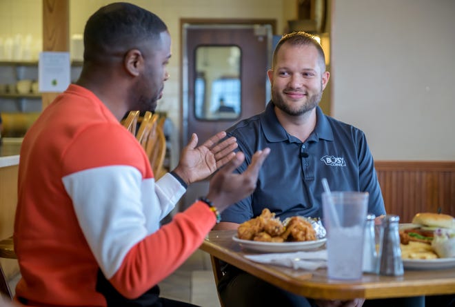 Busy Corner owner Derek Vollmer, right, chats with J Russell, host of "America's Best Restaurants", during taping of an episode at the popular restaurant Wednesday, March 13, 2024 in Goodfield.