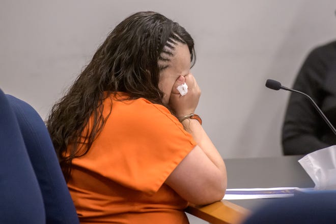 Stephanie Jones of Peoria cries and hides her face as evidence is shown in court during a sentencing hearing Thursday, April 25, 2024 at the Peoria County Courthouse. Judge John Vespa sentenced Jones to 100 years in prison for the 2022 death of her severely malnourished son.
