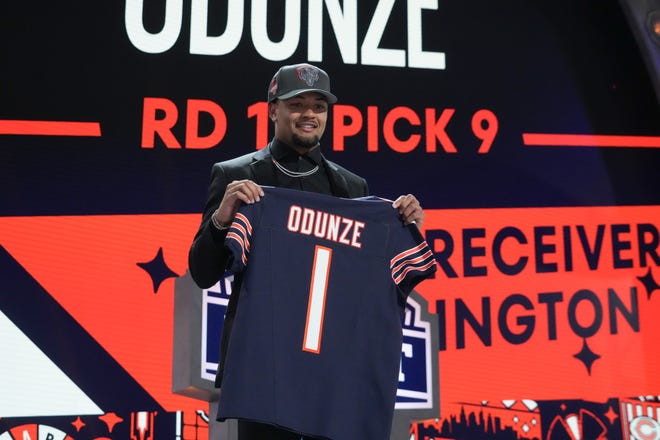 Apr 25, 2024; Detroit, MI, USA; Washington Huskies wide receiver Rome Odunze poses after being selected by the Chicago Bears as the No. 8 pick in the first round of the 2024 NFL Draft at Campus Martius Park and Hart Plaza. Mandatory Credit: Kirby Lee-USA TODAY Sports