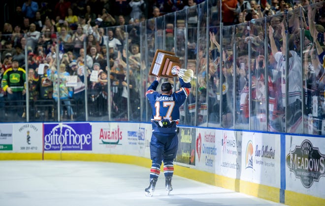 Peoria's Alec Hagaman parades the President's Cup along the boards for the crowd after the Rivermen defeated the Huntsville Havoc 5-1in the deciding game of the SPHL finals Sunday, April 28, 2024 at the Peoria Civic Center.