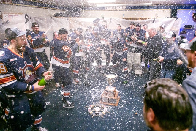 Champagne spray fills the Peoria Rivermen locker room as they celebrate their 5-1 victory over the Huntsville Havoc in the deciding game of the SPHL President's Cup finals Sunday, April 28, 2024 at the Peoria Civic Center.
