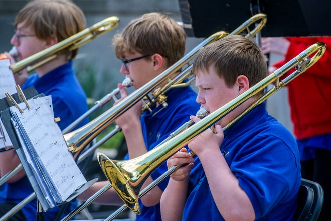 Performers in the brass section of the Monroe School band perform during the 38th Gerald M. Brookhart Arts in Education Series Spring Celebration on Wednesday, April 24, 2024 at the Peoria County Courthouse Plaza in downtown Peoria.