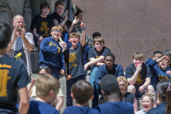 Students from St. Mark's Catholic School cheer on their fellow performers during the 38th Gerald M. Brookhart Arts in Education Series Spring Celebration on Wednesday, May 1, 2024 at the Peoria County Courthouse Plaza in downtown Peoria.
