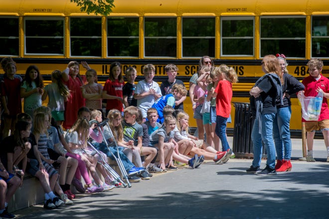 Young performers from Hollis Grade School wait for their showtime during the 38th Gerald M. Brookhart Arts in Education Series Spring Celebration on Wednesday, May 1, 2024 at the Peoria County Courthouse Plaza in downtown Peoria.