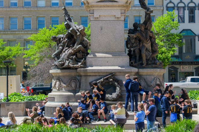 A small crowd from St. Mark's Catholic School fill the Soldiers and Sailors Monument to watch a performance during the 38th Gerald M. Brookhart Arts in Education Series Spring Celebration on Wednesday, May 1, 2024 at the Peoria County Courthouse Plaza in downtown Peoria.