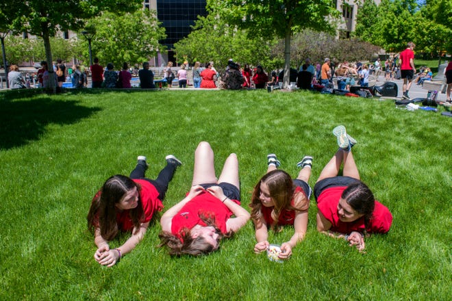 Students from Hollis Grade School catch some rays on the lawn before their performance during the 38th Gerald M. Brookhart Arts in Education Series Spring Celebration on Wednesday, May 1, 2024 at the Peoria County Courthouse Plaza in downtown Peoria.