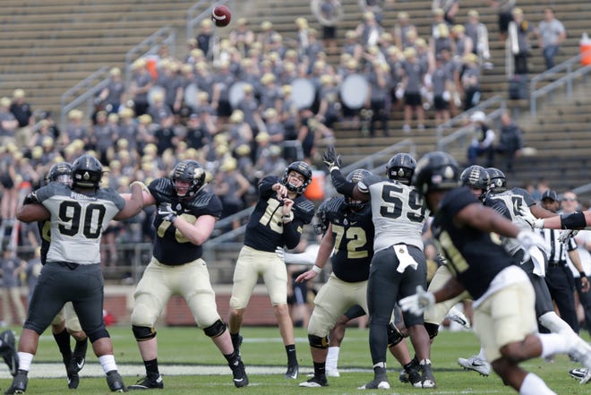Purdue quarterback Aidan O'Connell (16) throws during the first quarter of the Purdue University spring game, Saturday, April 6, 2019, at Ross-Ade Stadium in West Lafayette.

(Nikos Frazier | The Journal & Courier)