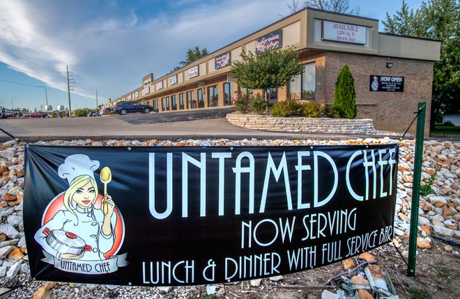 A large sign advertises the dining service and bar at the Untamed Chef, 7338 N. University St., in Peoria.
(Credit: MATT DAYHOFF/JOURNAL STAR)